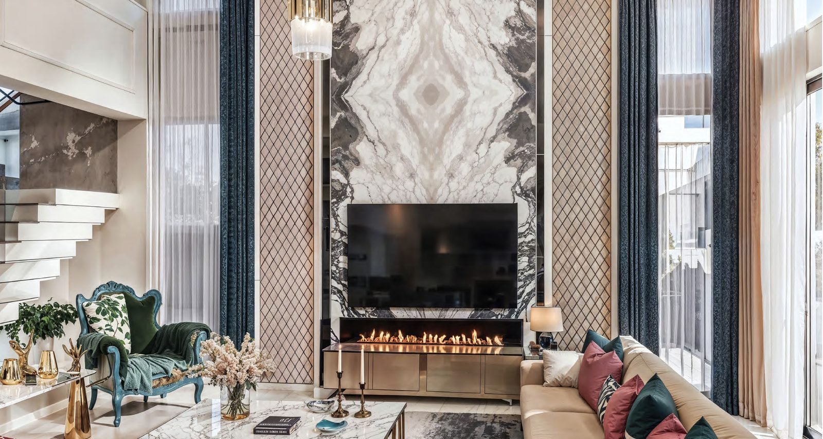 A living room with a marble fireplace wall.